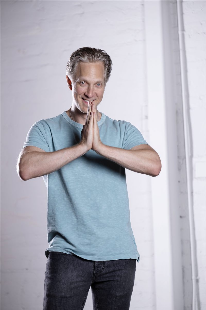 Randy with his hands together